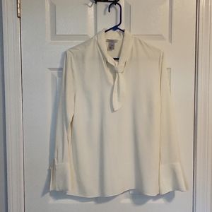Womens dress shirt with tie neck and bell cuffs.